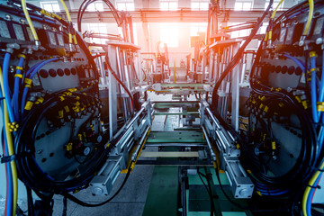 Factory for aluminum and PVC windows and doors production. Details industrial equipment.