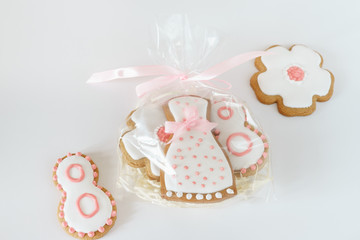 sweet gingerbread cookies white icing plastic bag pink ribbon