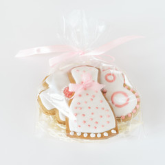 sweet gingerbread cookies white icing plastic bag pink ribbon