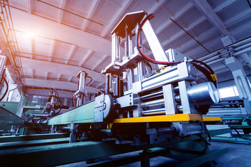 Factory for aluminum and PVC windows and doors production. Details industrial equipment.