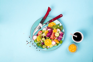 Organic vegetarian salad with vegetables and sauce.