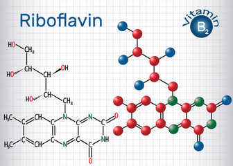 Riboflavin, (vitamin B2) , is found in food and used as a dietary supplement.  Structural chemical formula and molecule model. Sheet of paper in a cage