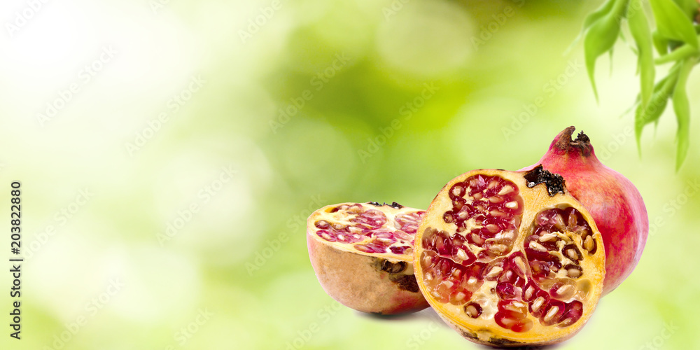 Wall mural pomegranate fruit on natural background - Wall murals
