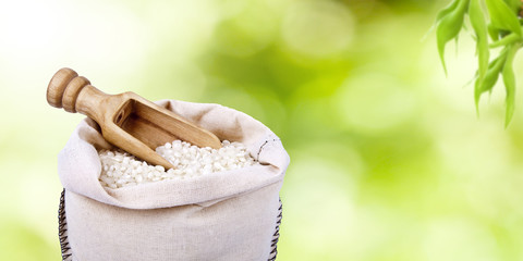raw rice in the sack with a natural background