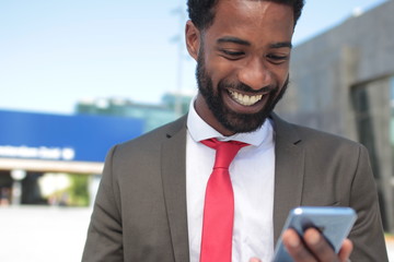 Beautiful happy businessman outside