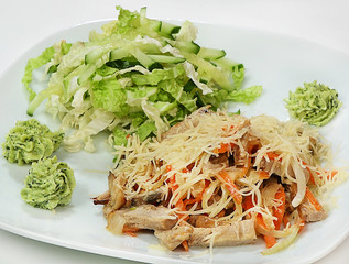 Warm salad of pork, vegetables and mushrooms in cream, salad and cheese mix