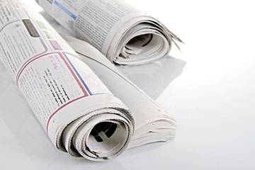 news paper sitting on a table