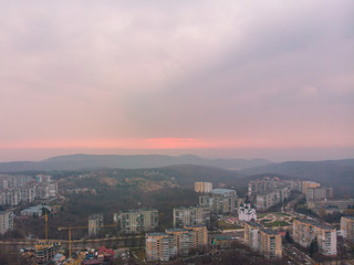 Fototapeta na wymiar beautiful cityscape with sunrise. red sun rise above the mountains