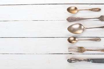 Old cutlery. Top view On a wooden background, Copy space.
