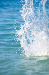 large transparent splashes sea water on a Sunny day