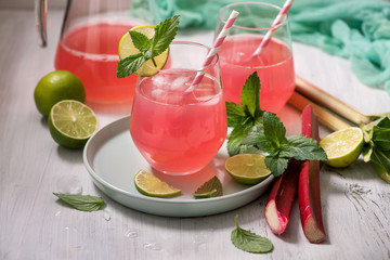 Refreshing summer rhubarb lemonade drink with lime and mint