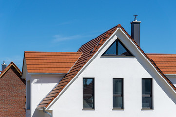 part of a facade and roof of a new house