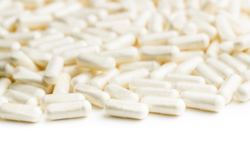 Fototapeta na wymiar White medicine capsules.