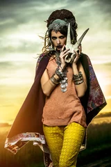 Zelfklevend Fotobehang jonge zigeuner met schedel © Andrey Kiselev