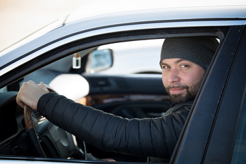 Portrait of man in his car.