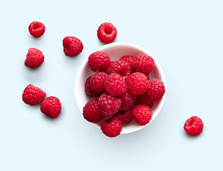 Bowl of raspberries isolated on white background