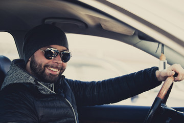 Portrait of man in his car.