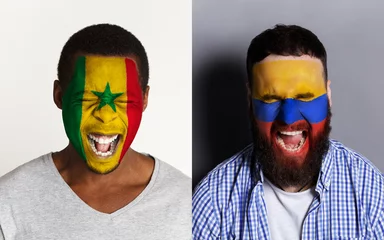 Foto op Plexiglas Emotional soccer fans with painted flags on faces © Prostock-studio