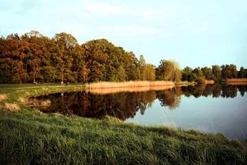 walk on the lake at sunset. visible reflection on the lake.