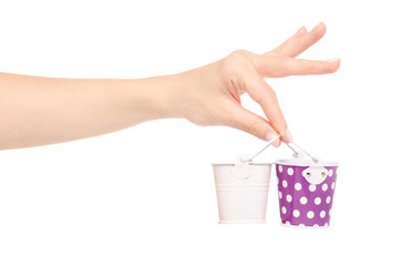 Fototapeta premium Small buckets in a hand