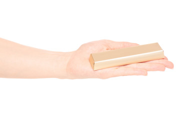 A bar of chocolate in a golden wrapper in hand