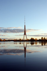 Fototapeta premium The tv tower is reflected in the water, in the evening. Riga, Latvia