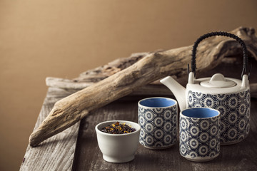 White and blue tea set on wooden table