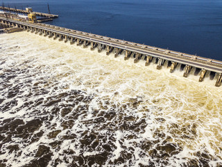 aerial view of hydro power plant damb with water passing through it