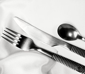 knives and forks laid out on the table