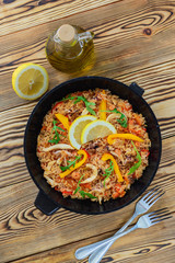 Spanish paella on a wooden table