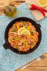 Spanish paella on a wooden table