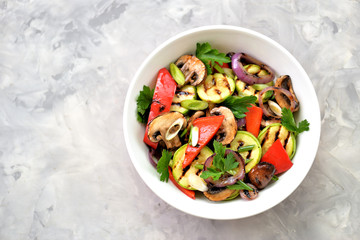 Grilled vegetables - zucchini, portobello mushrooms, red pepper, red onion, green onion, garlic, olive oil, wine vinegar, sea salt and parsley. Healthy food.