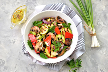 Grilled vegetables - zucchini, portobello mushrooms, red pepper, red onion, green onion, garlic, olive oil, wine vinegar, sea salt and parsley. Healthy food.