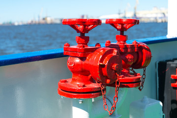 Red fireplugs on the ship