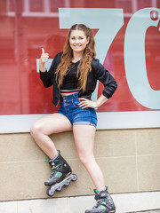 Woman wearing roller skates next to sale