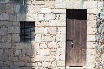 Window and wooden door in an old castle