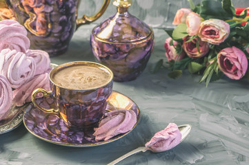 Hot chocolate in a beautiful Golden Cup with a pink marshmallow home made