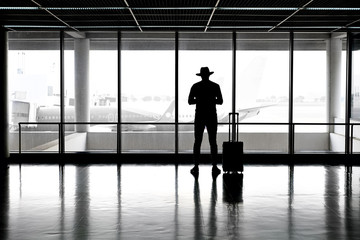 Fototapeta na wymiar Man in hat in airport