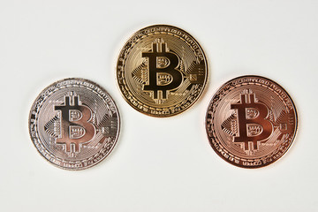 Bitcoin collection isolated on white background. Three bitcoin cryptocurrency gold, silver and bronze, close-up