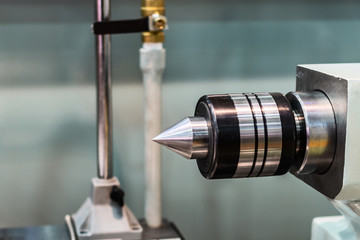 The tailstock of a modern CNC lathe.