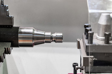 metal workpiece clamped in the lathe chuck CNC machine
