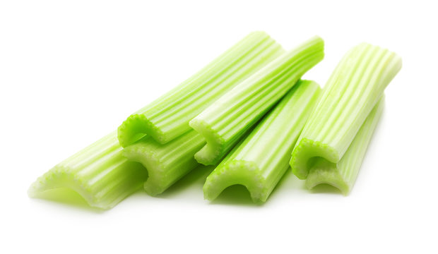 heap of green fresh celery isolated on white backgroun