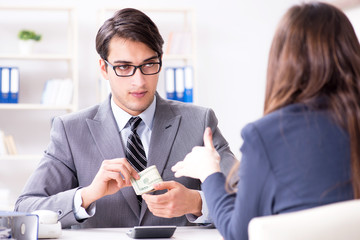 Businessmanbeing offered bribe for breaking law