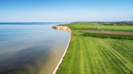 Field and sea. Agricultural landscape from air