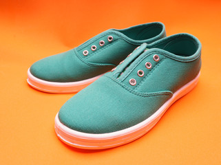 Green Sneakers on Orange