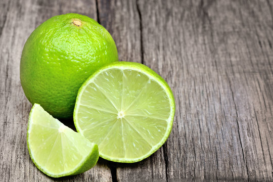 Lime on rustic wood board background