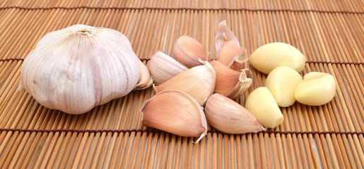 fresh garlic isolated on bamboo mat