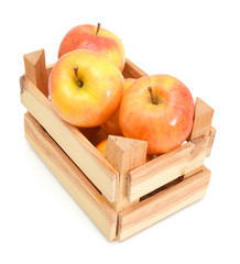 Fresh America apples in wooden crate on white