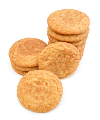 Stack of snickerdoodles over white.