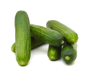 Healthy food. The green cucumbers isolated on white background